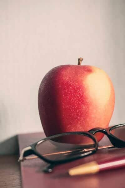 Apple on old book compared to old 100 blogs